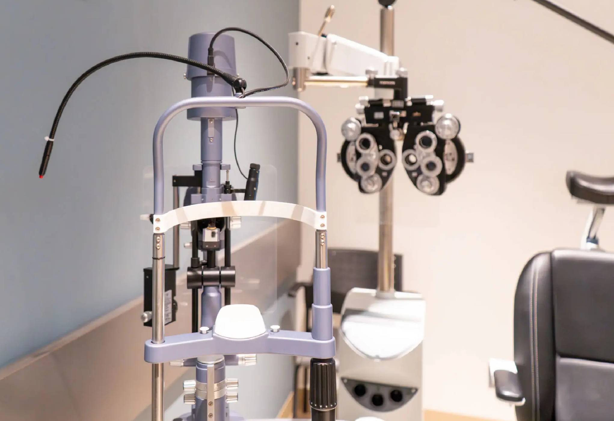 Ophthalmic equipment set up in an eye examination room.